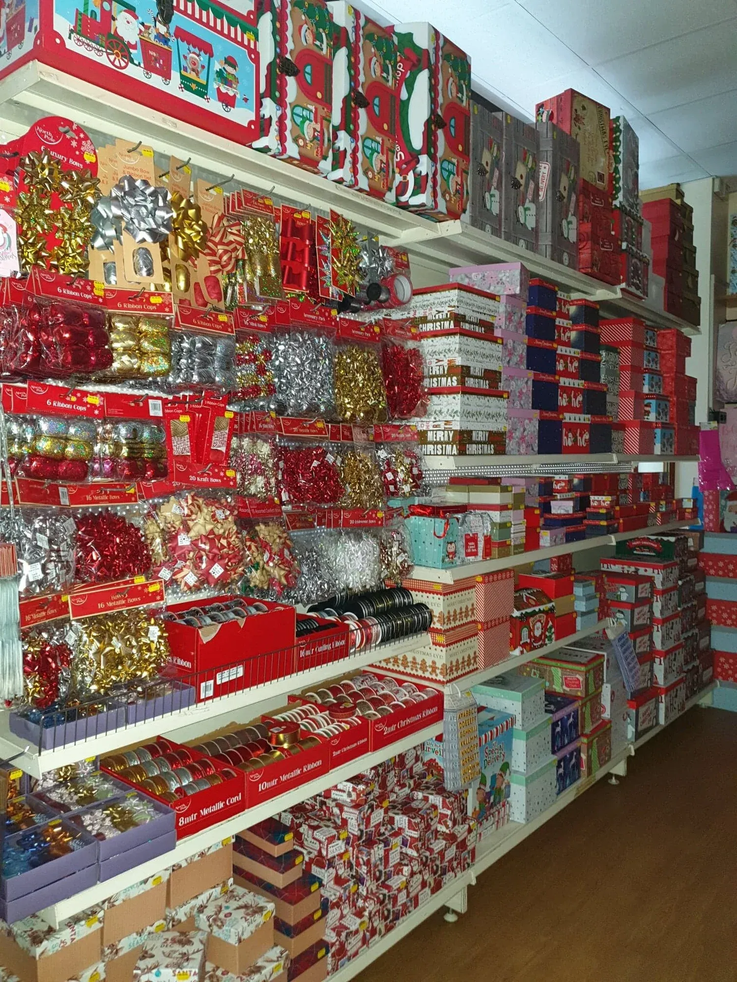 Shelves of candles, mugs and boxed gifts
